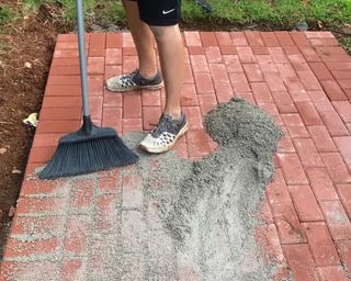Final step of laying a brick patio