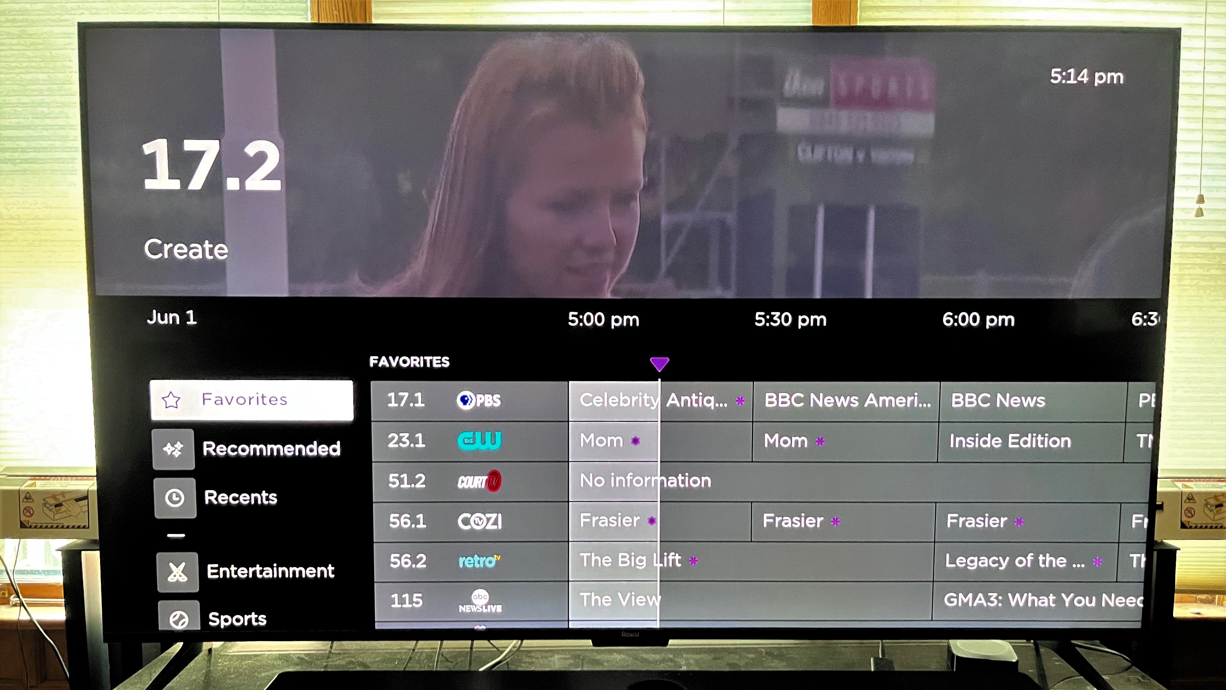 Roku Plus Series TV Live TV program guide shown onscreen
