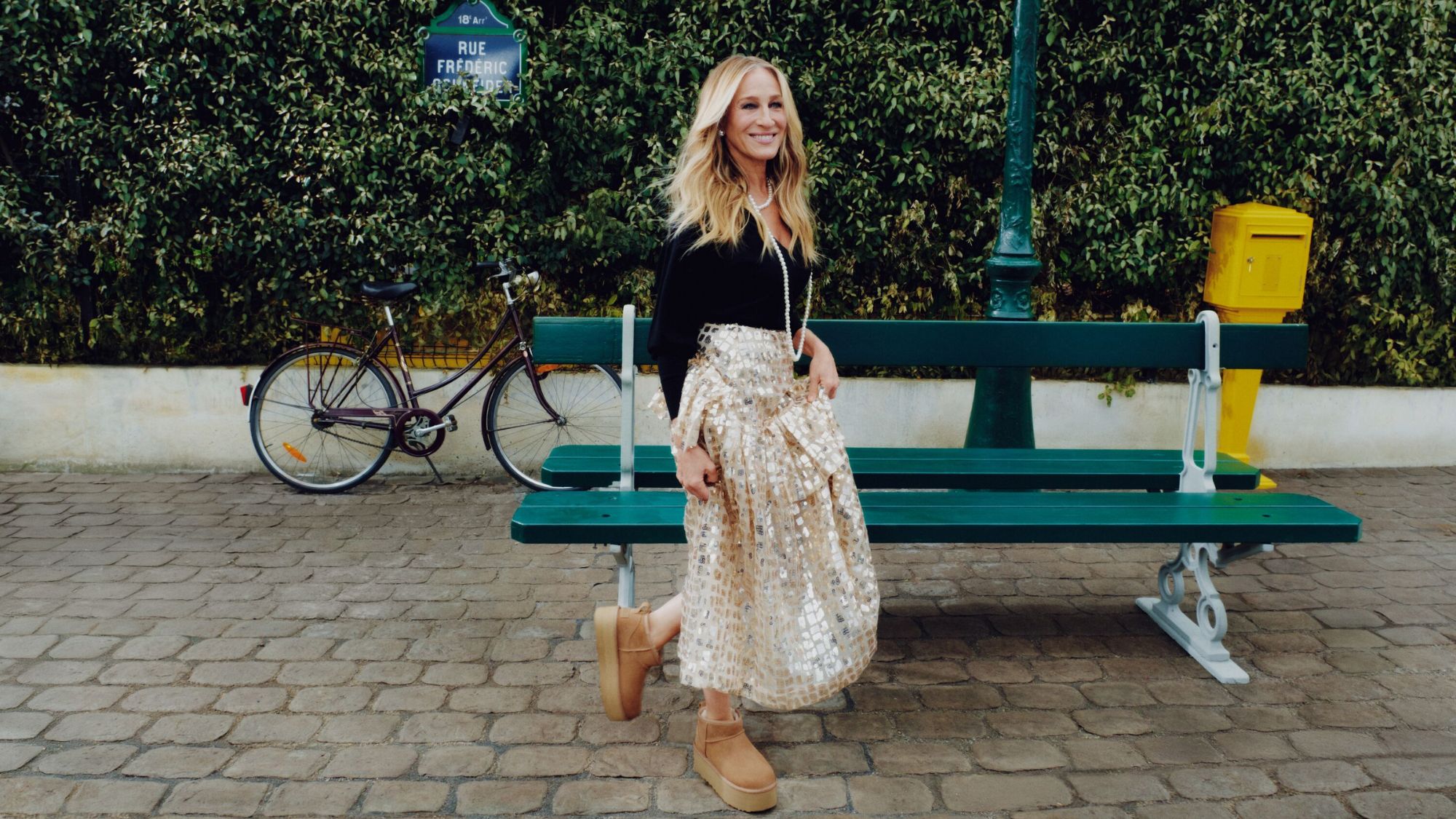 sarah jessica parker in paris wearing a skirt and uggs