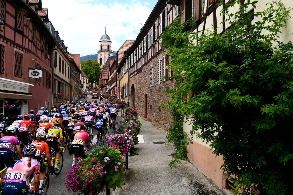 LE MARKSTEIN FRANCE JULY 30 A general view of the peloton passing through Rorschwihr village landscape during the 1st Tour de France Femmes 2022 Stage 7 a 1271km stage from Slestat to Le Marksteinc TDFF UCIWWT on July 30 2022 in Le Markstein France Photo by Tim de WaeleGetty Images