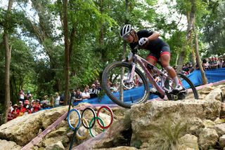 Evie Richards riding a pink Trek SuperCaliber