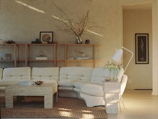 living room with white sofa and lamp
