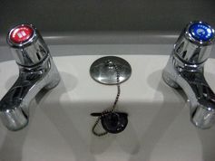 Typical hot and cold taps - marked red and blue.