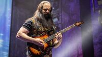 John Petrucci onstage in Norway with his signature Ernie Ball Music Man JP Series signature guitar