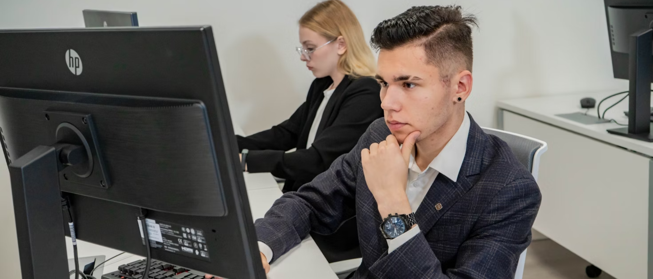 Students in front of computer in classroom
