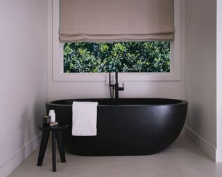 black bathtub in jen atkin's bathroom