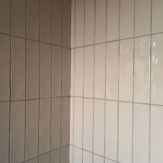 Pale vertical tiles with pale grey grouting
