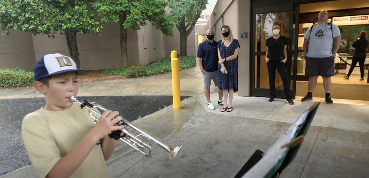 Jason Zgonc plays the trumpet outside Emory Decatur Hospital in Georgia.