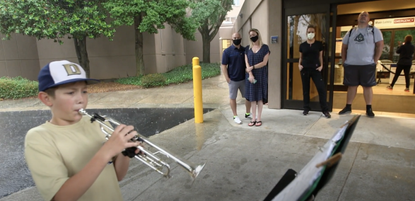 Jason Zgonc plays the trumpet outside Emory Decatur Hospital in Georgia.
