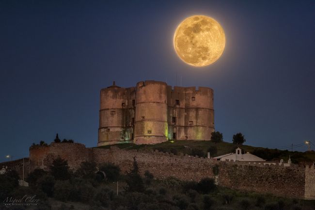 Orange Supermoon Lights Up a Portuguese Castle in Night-Sky Photo