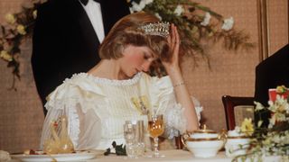 AUCKLAND, NEW ZEALAND - APRIL 29: Princess Diana Adjusting Her Tiara During A Banquet In New Zealand