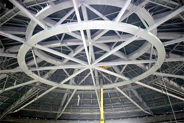 The roof has a large, circular central section from which the supports extend to the walls.