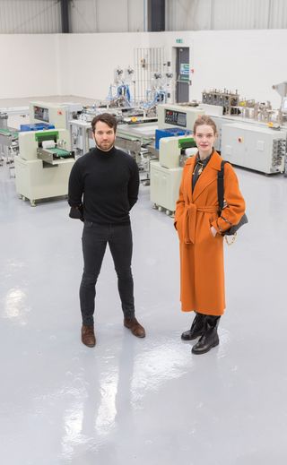 CEO Johann Boedecker and Vodianova standing in the state of art laboratory