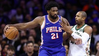 Joel Embiid #21 of the Philadelphia 76ers dribbles by Al Horford #42 of the Boston Celtics during the fourth quarter at the Wells Fargo Center on November 15, 2023
