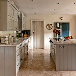 grey and white kitchen with tiles flooring