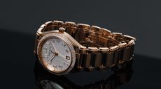 Rose gold patek philippe watch on a dark background