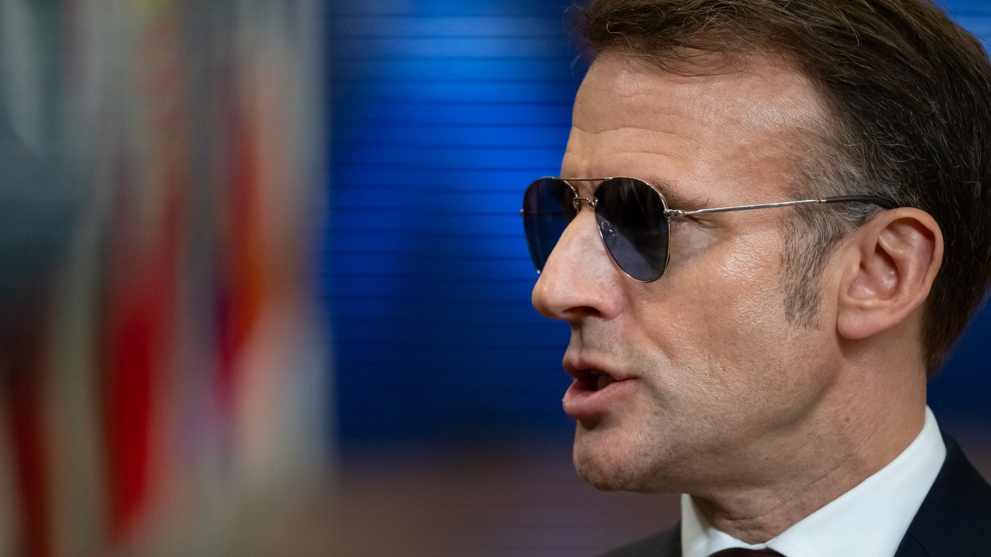 France's President Emmanuel Macron in aviator-style sunglasses