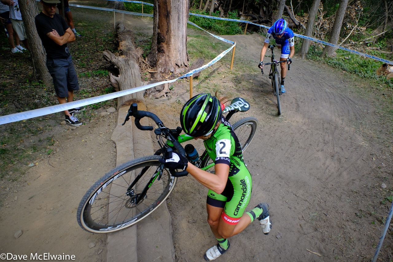 Kaitie Antonneau (Cannondale) runs a log step barrier with Maghalie Rochette chasing her.