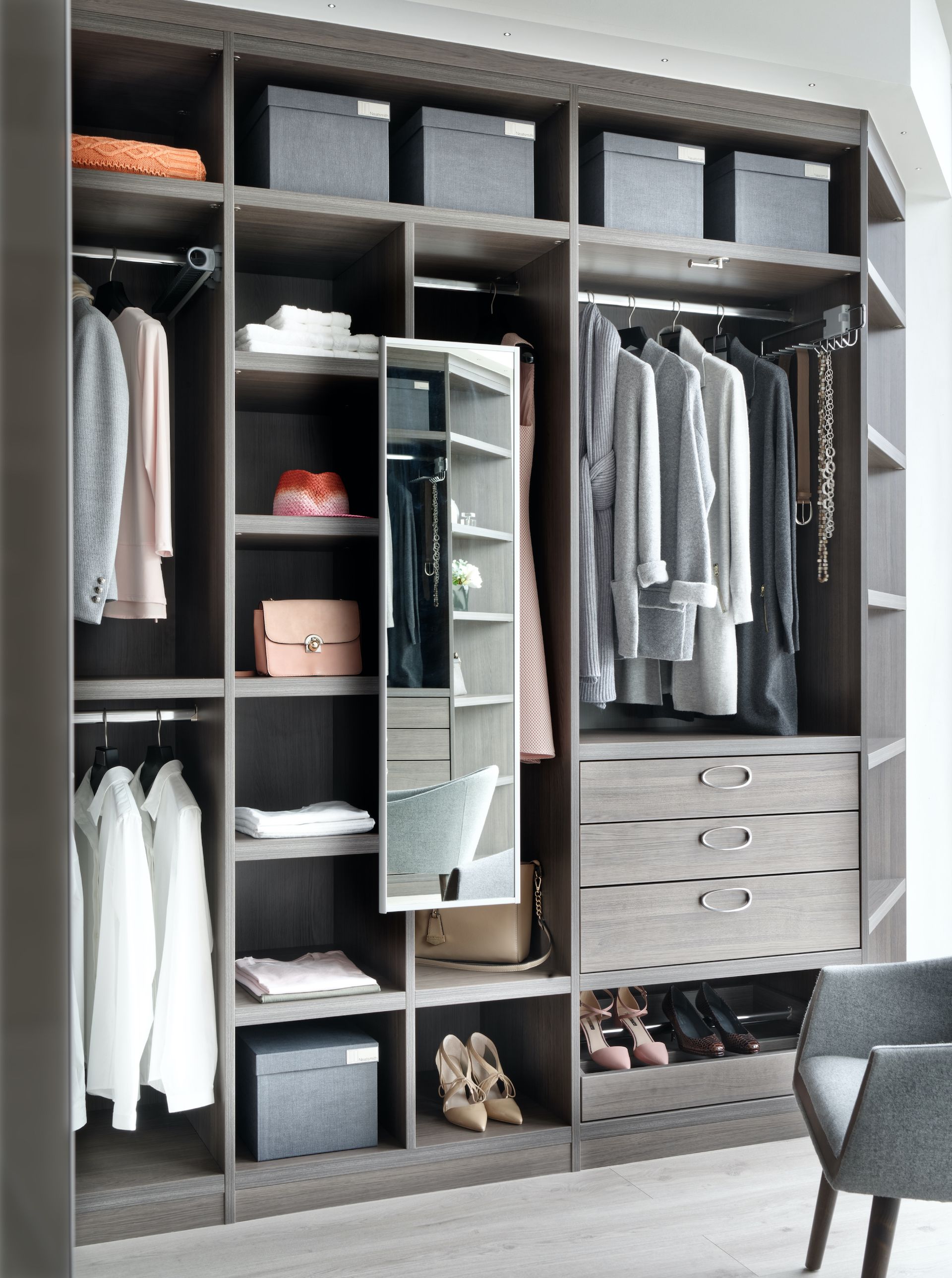 open wardrobes filled with clothes