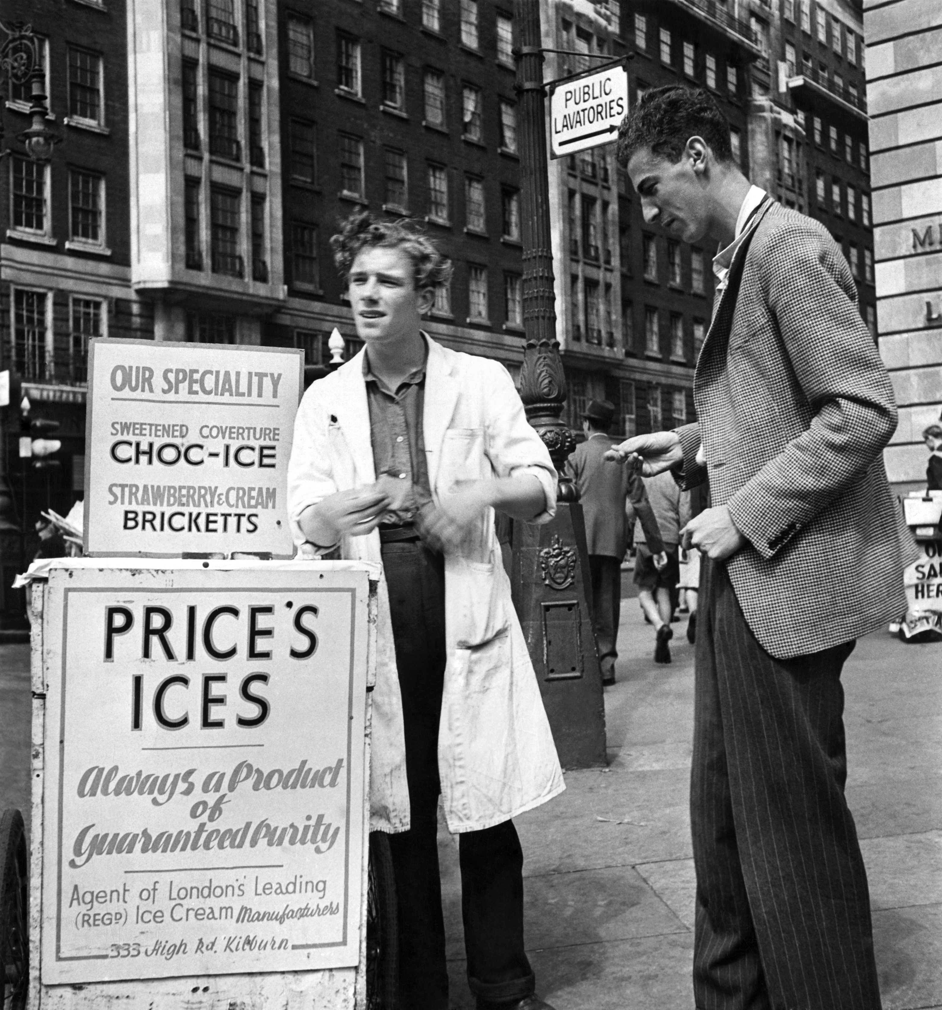 Black and white image of an old school ice-cream stand