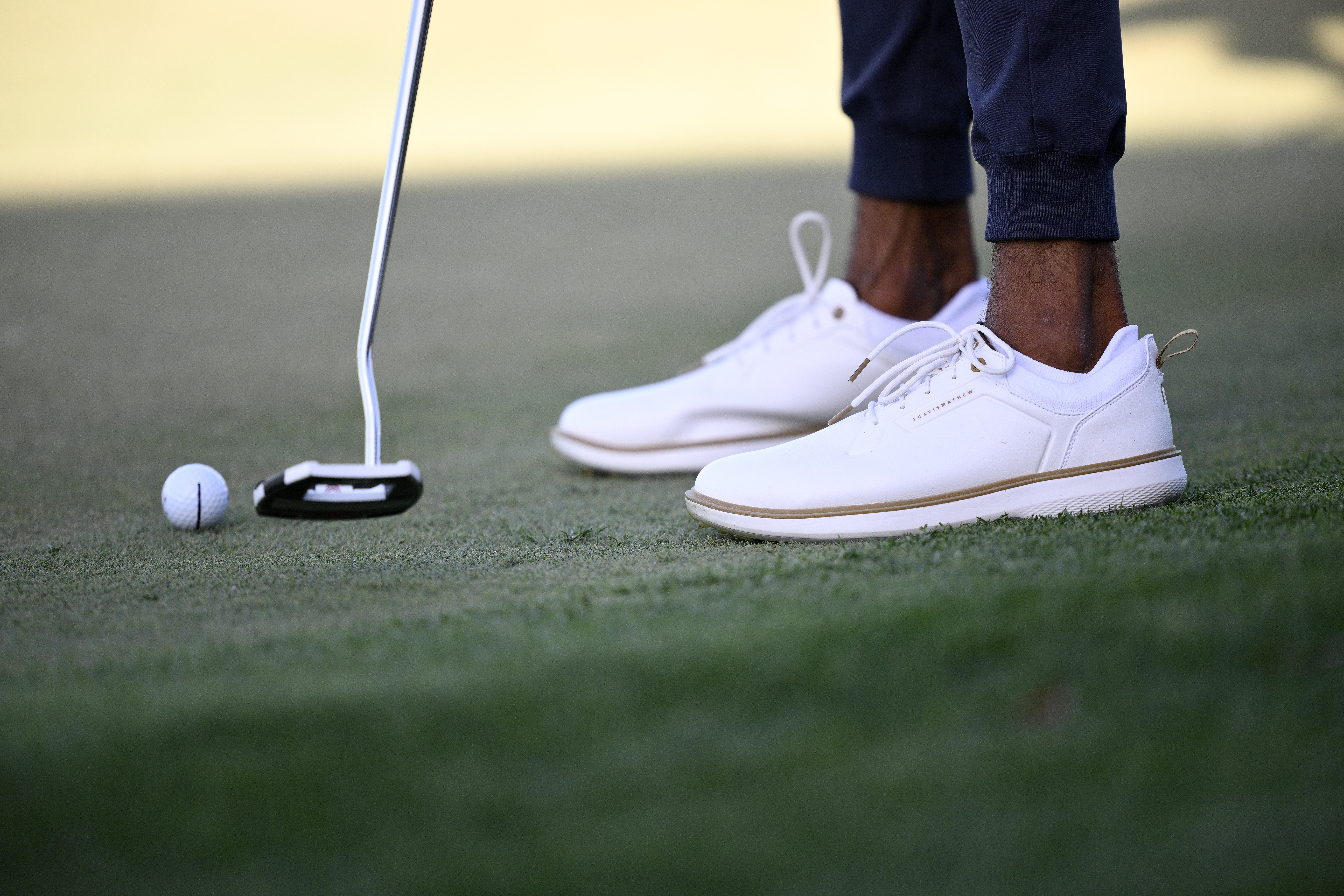 A close up of Akshay Bhatia's golf shoes