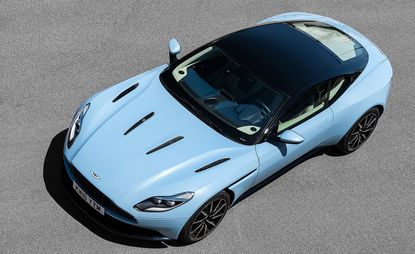 Aerial view of light blue Aston Martin DB11 sports car