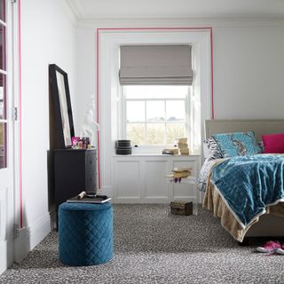 white bedroom with animal print carpet and paint detail around window and door