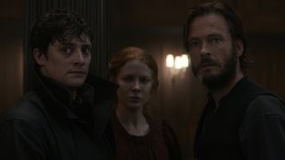 Maura, Daniel, and Eryk stand close together as they look at something off screen in Netflix's 1899 TV show