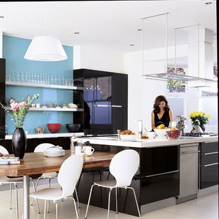 kitchen with women and smart refrigerator