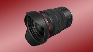 Canon RF 15-35mm f/2.8L IS USM lens review: Image shows the lens against a red backdrop.