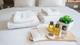 Amenities on a hotel room bed