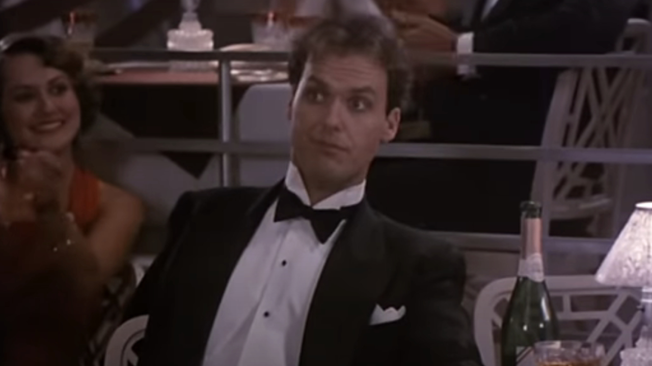 Michael Keaton as Johnny Dangerously wearing a tuxedo in Johnny Dangerously