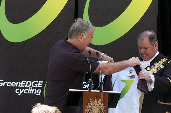 Lord Mayor Robert Doyle is presented with a GreenEdge jersey from Gerry Ryan.