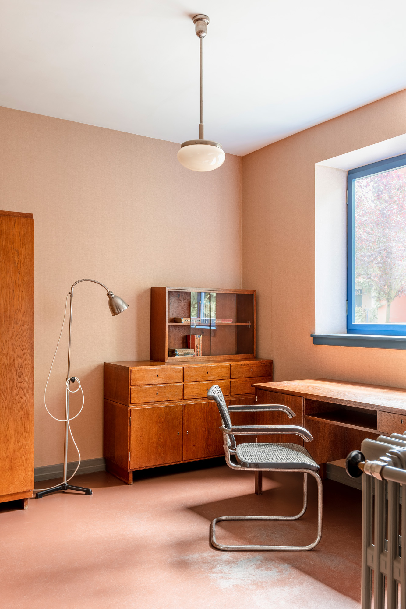 modernist interior of Neues Frankfurt house with colourful walls and 20th century furniture