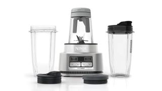 Ninja Foodi Smoothie Bowl Maker and Nutrient Extractor with two spare cups next to it, one of the Ninja blenders on sale