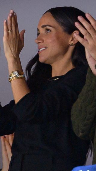Meghan Markle, The Duchess of Sussex, reacts during an NHL game
