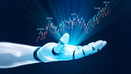 A trading graph floats about an open robot hand.