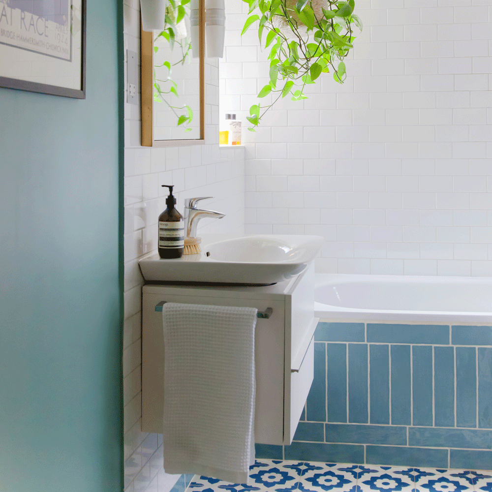 bathroom with white tiles and basin