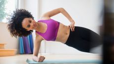 Woman doing the side plank as part of her core exercises
