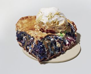 Wedge shaped pastry pie with berries and ice cream
