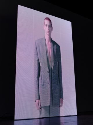 Model wears jackets by Dior A/W 2022 menswear
