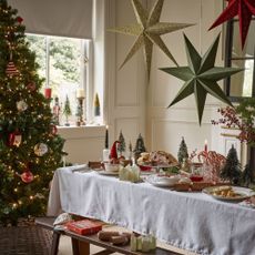 Freiburg pine pre-lit tree (7ft), £369; Baubles from £1.99; Paper stars, £14.99 each; Mikasa crockery, from £6.99; Santa and Nutcracker Christmas glasses (set of 4), £8.99; Gonk mug and bowl set, £14.99