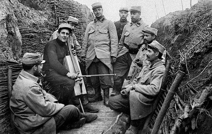 A soldier with a trench cello of the type used by by Harold Triggs, pictured in a French trench in 1914. (Photo by Neurdein/Roger Viollet/Getty Images)