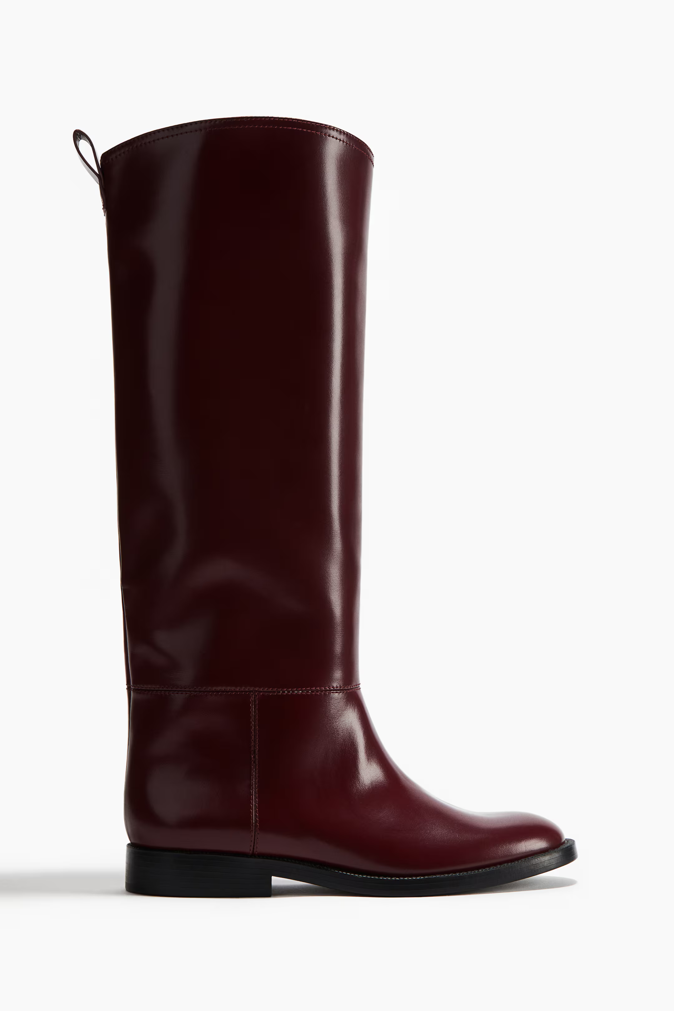 A pair of red knee high boots.