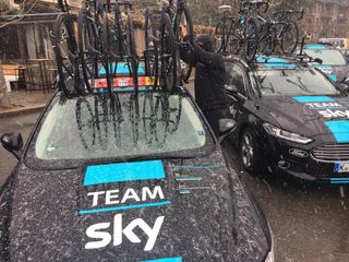 The Team Sky cars were covered by snow