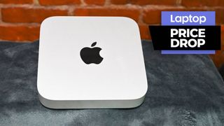 Apple Mac mini M2 compact desktop against brick wall background