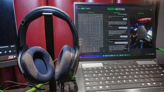 Razer's concept AI headset next to a gaming laptop with Razer Project Motoko on screen