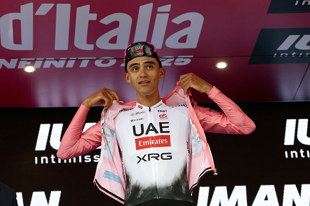 UAE Team Emirates XRG's Mexican rider Isaac Del Toro celebrates the Pink Jersey of the overall leader on the podium of the 13th stage of the 108th Giro d'Italia cycling race of 180kms from Rovigo to Vicenza on May 23, 2025. (Photo by Luca Bettini / AFP)