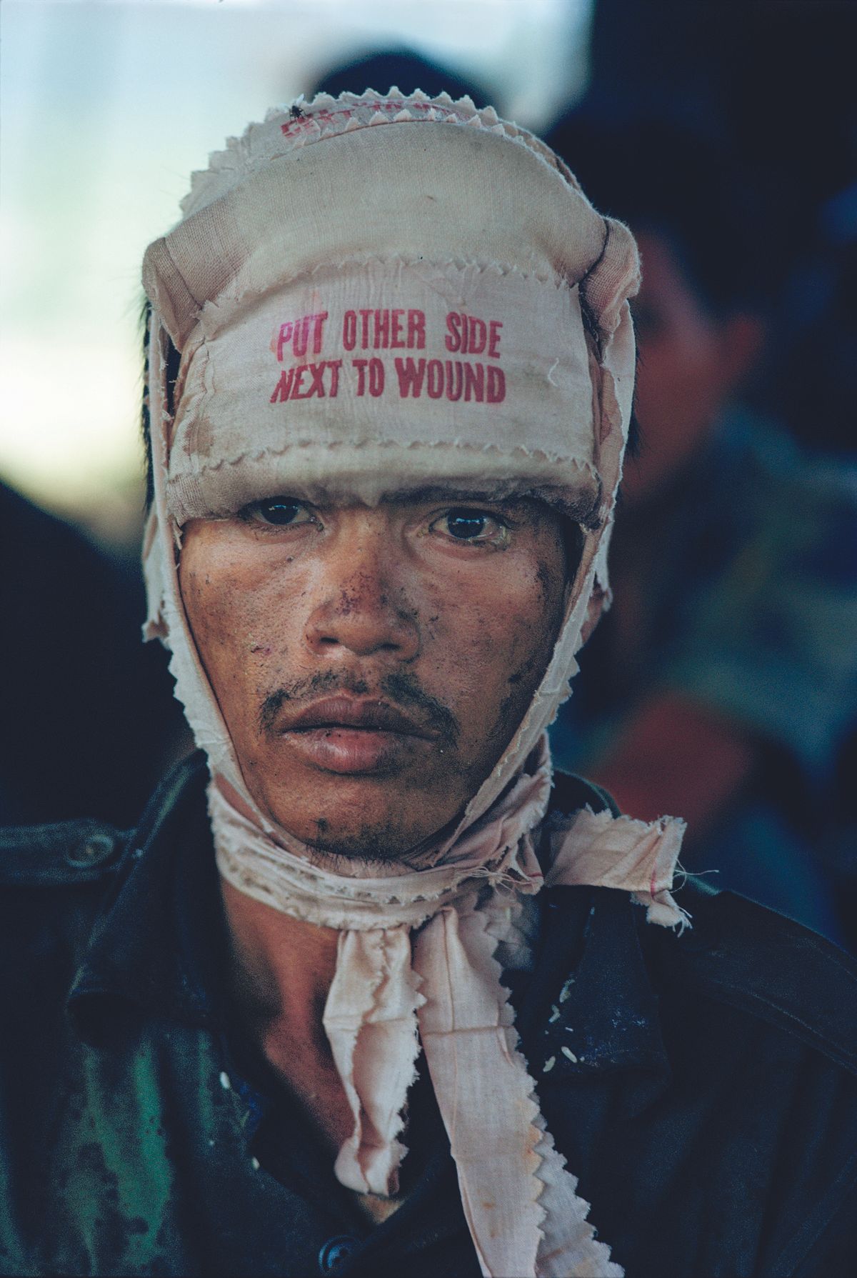 Wounded South Vietnamese soldier on National Highway 1, The Sunday Times cover.