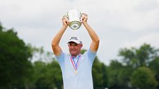 Padraig Harrington holds a trophy aloft
